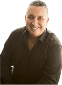 Dr Tom Barber in a black shirt promoting self improvement and personal development through online courses and resources.
